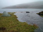 Rising river beside tent